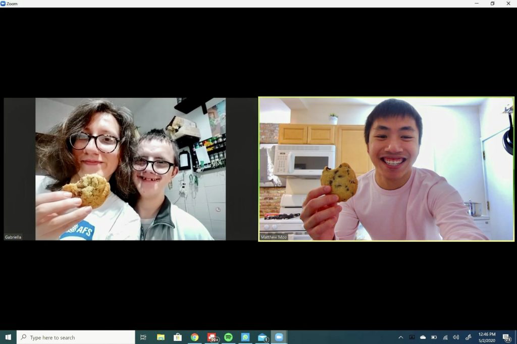 Baking chocolate chip cookies over Zoom. The author with her little brother on the left, her friend on the right.